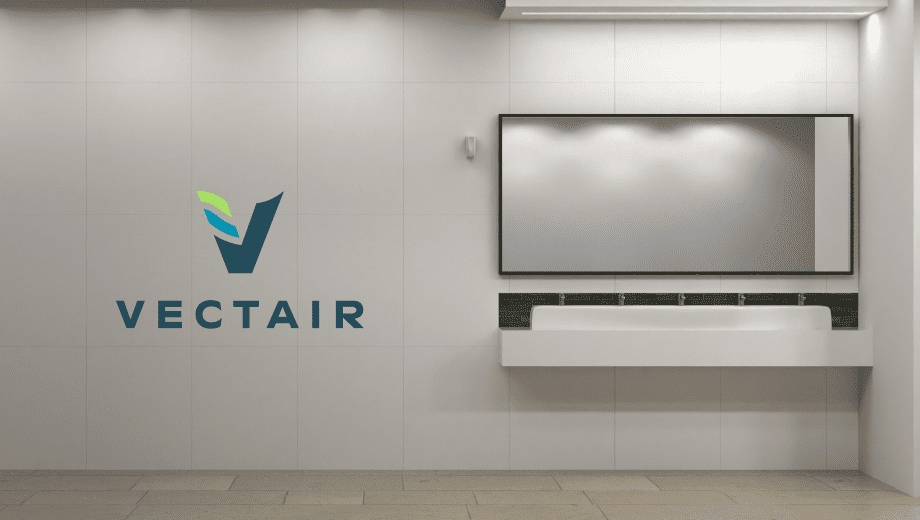 The Vectair Logo floats near a nice public bathroom sink and mirror.